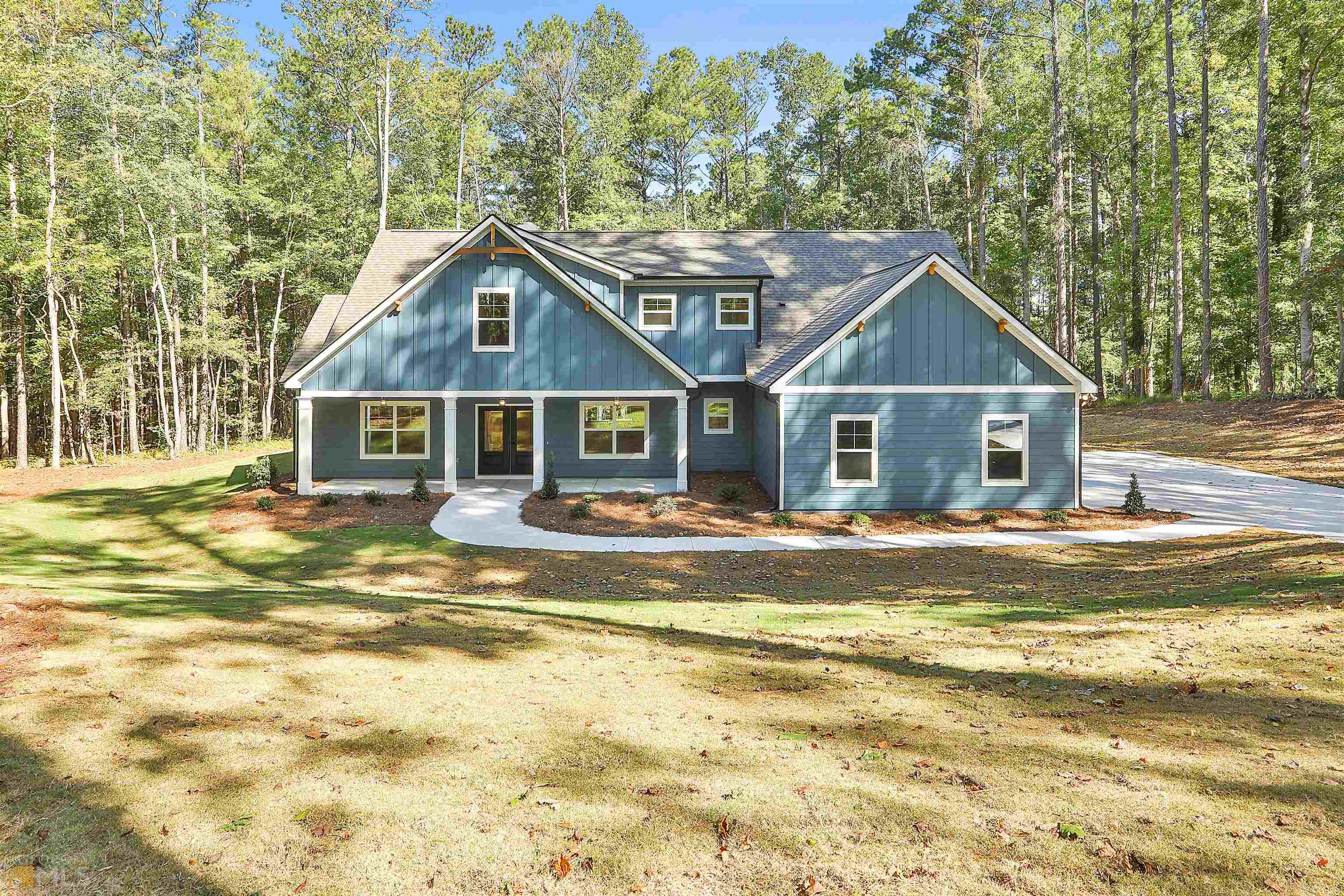 47 Sanders-Davis Road, Unit 15 Newnan, GA 30263 - Photo 1 of 1 a view of a house with a swimming pool