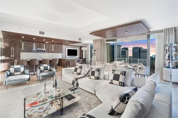 a living room with furniture and a large window