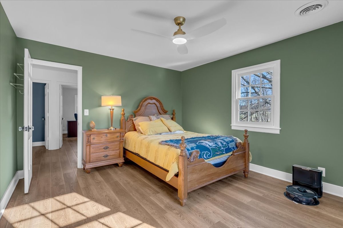 251 Miller Road Hillsboro, TN 37342 - Photo 49 of 80 a bedroom with a bed and a chandelier