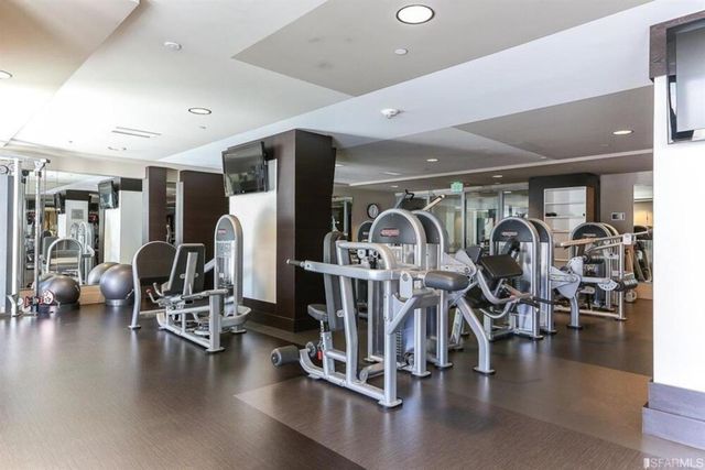 a swimming pool with outdoor seating and yard