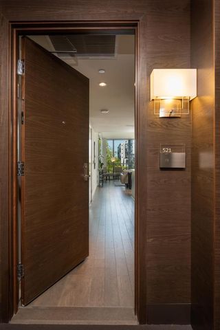 a view of hallway with wooden floor