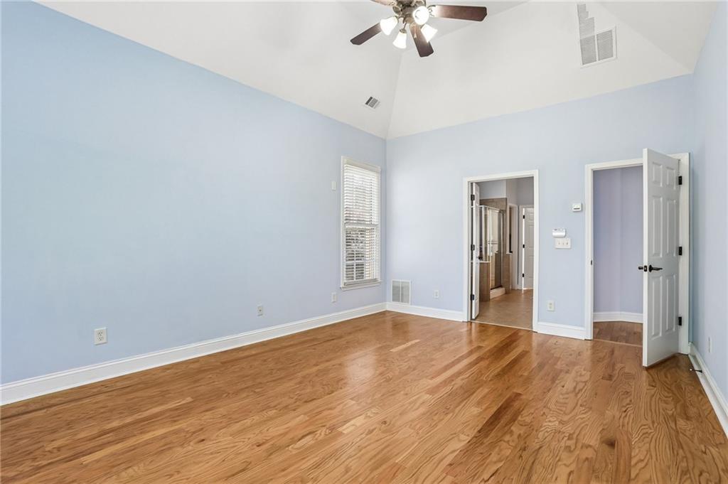 810 Freedom Way Cumming, GA 30040 - Photo 19 of 61 a view of an empty room with wooden floor
