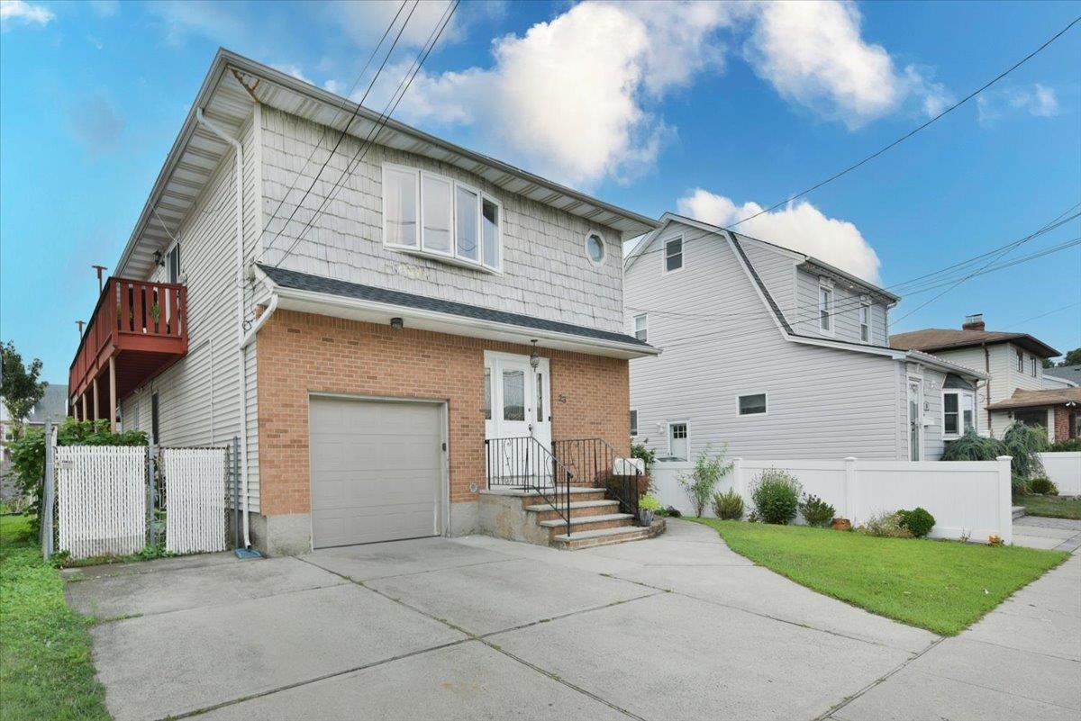 23 Monroe Street Franklin Square, NY 11010 - Photo 1 of 1 a front view of a house with a yard and garage