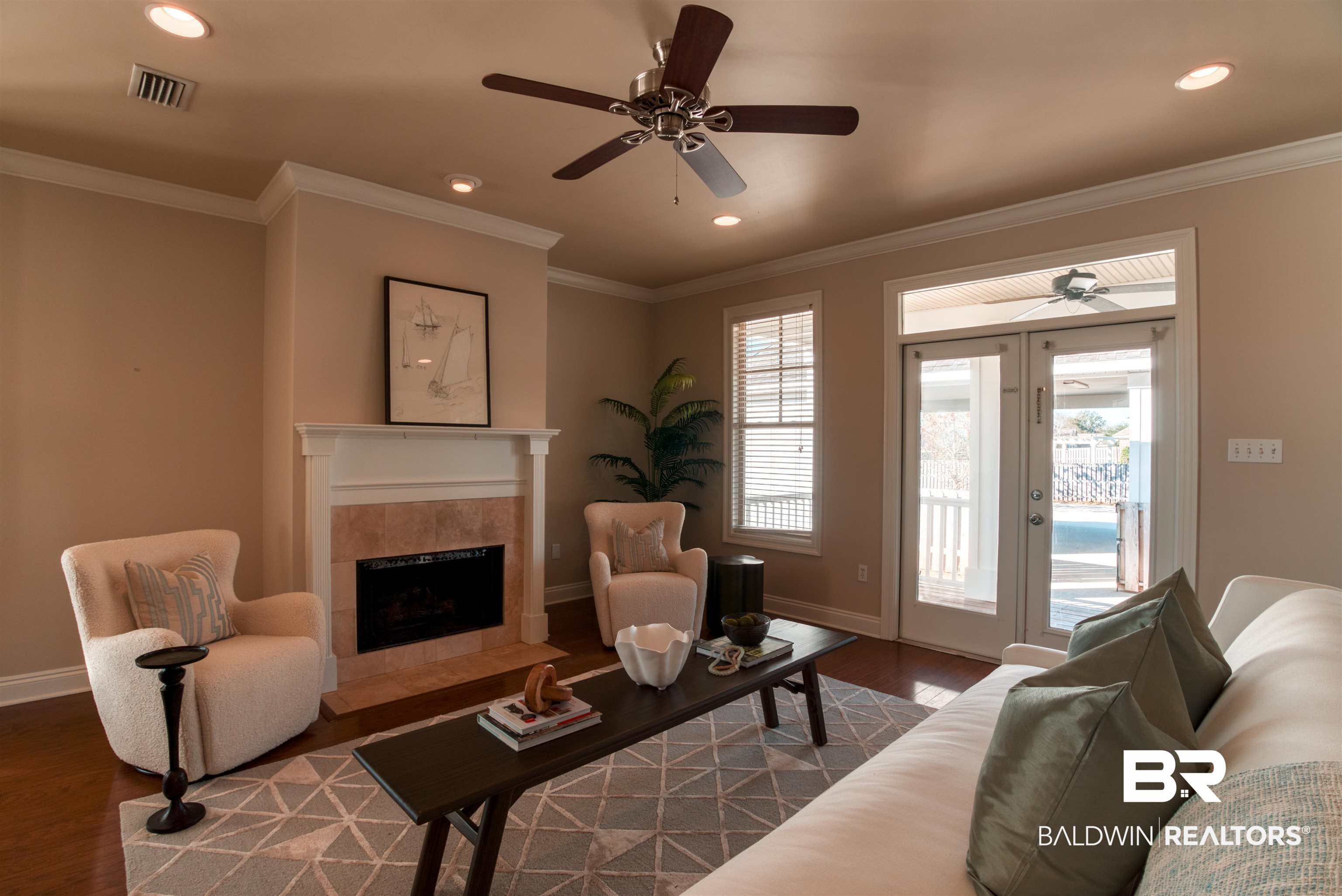 24561 Austin Road Daphne, AL 36526 - Photo 17 of 57 Living room featuring hardwood / wood-style floors, ceiling fan, crown molding, and a fireplace