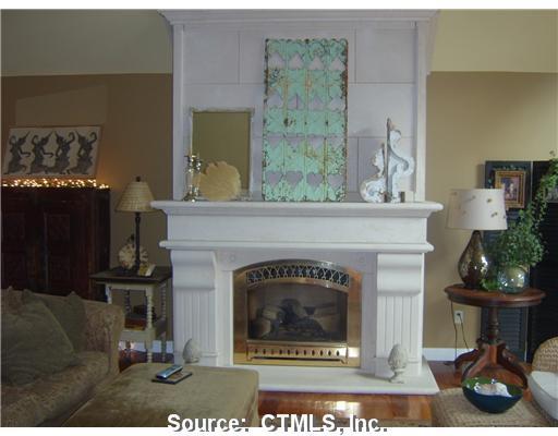 10 Nightengale Road Woodstock, CT 06281 - Photo 1 of 1 a living room with furniture and a fireplace