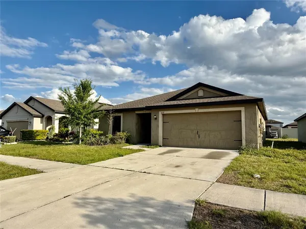 a front view of a house with yard