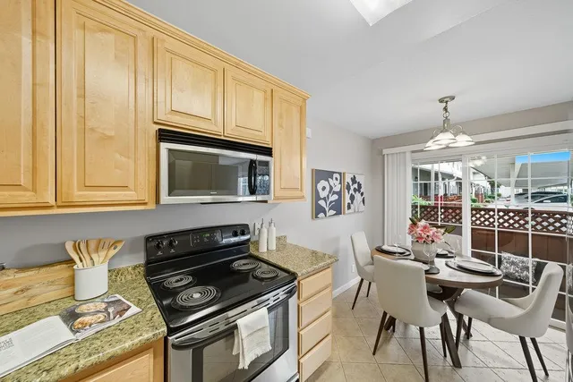 a kitchen with a stove and a microwave