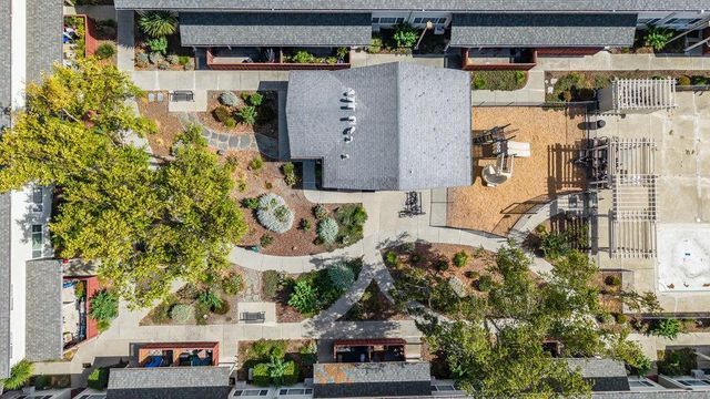 an aerial view of multiple houses with yard