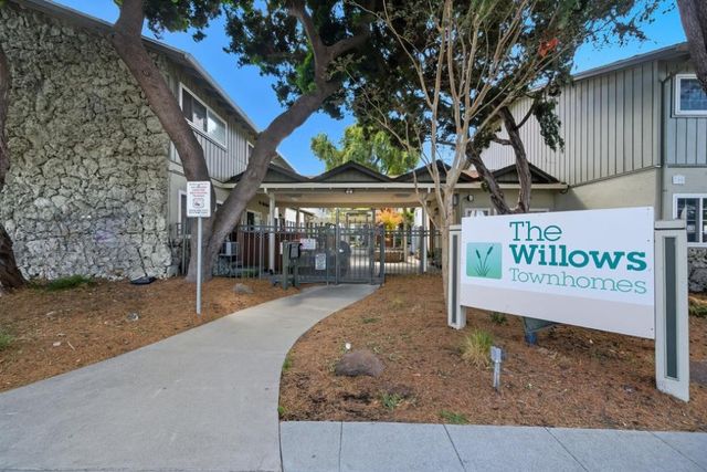 a view of a street with sign board