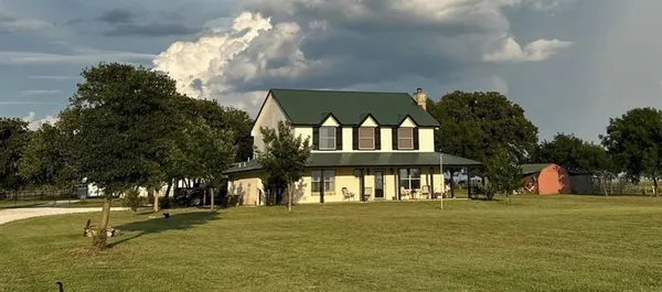 a view of a house with a big yard