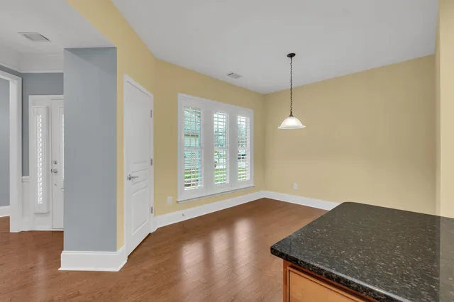 a view of a livingroom with a kitchen