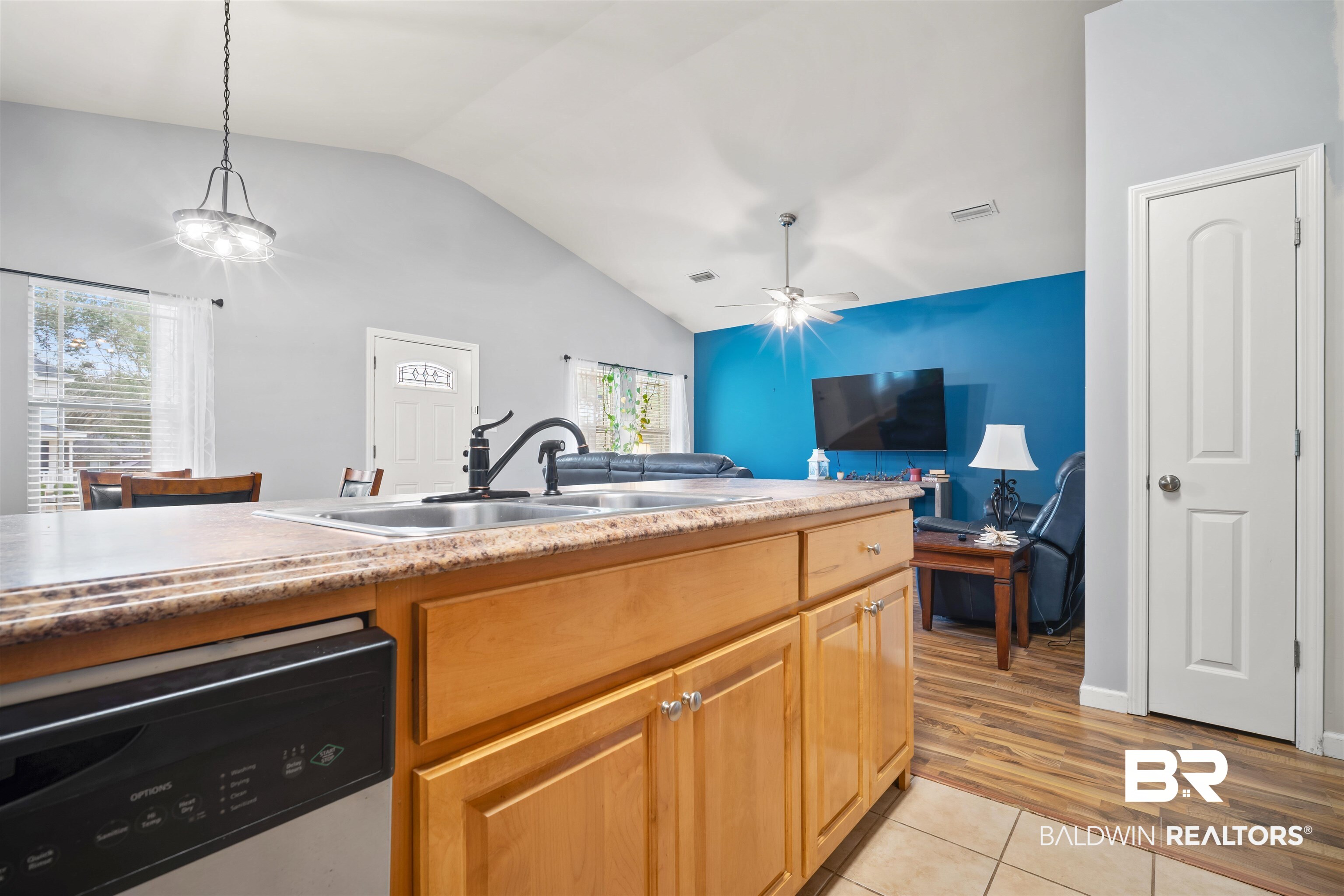 209 Maplewood Loop Daphne, AL 36526 - Photo 9 of 23 Kitchen featuring dishwasher, lofted ceiling, light countertops, light tile patterned floors, and pendant lighting
