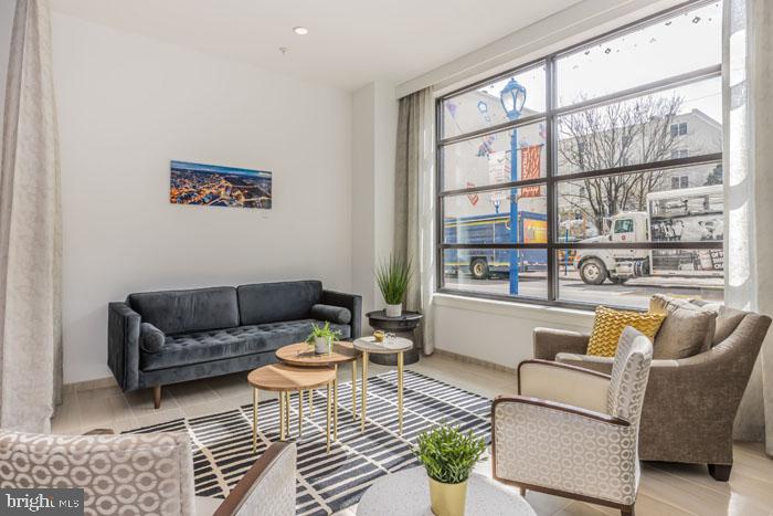 131 Bridge Street, Unit 2B22416 Phoenixville, PA 19460 - Photo 16 of 104 a living room with furniture and a large window