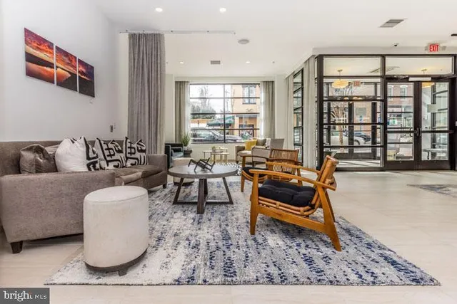 a bedroom with furniture and a rug