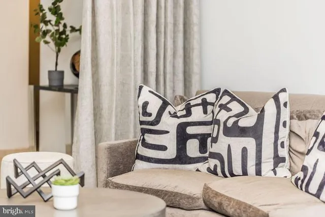 a bedroom with a bed and a potted plant