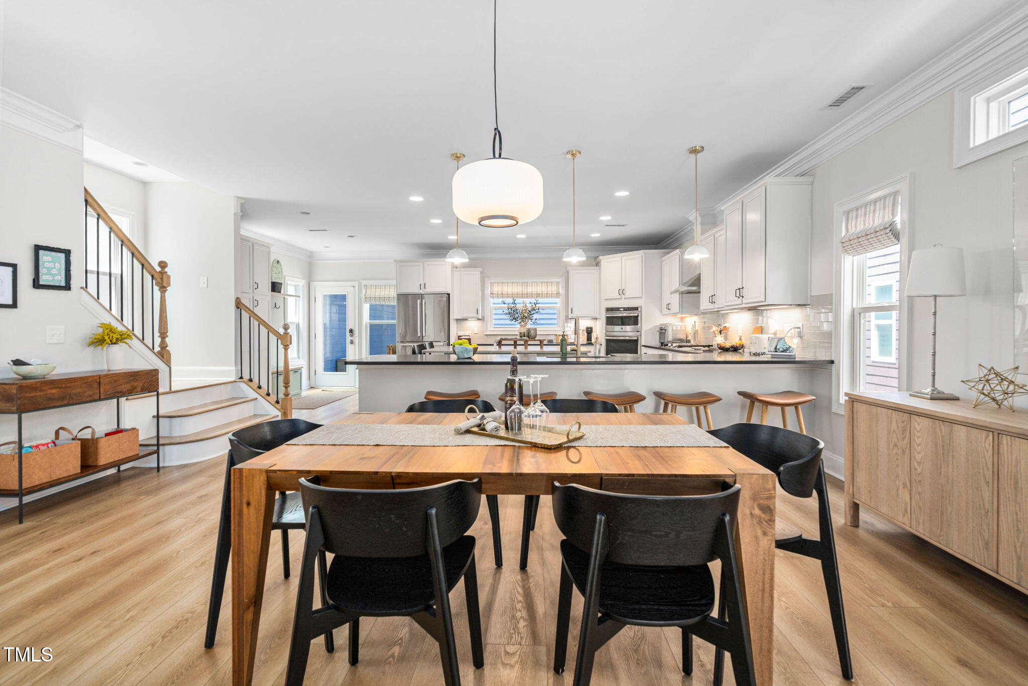 1344 Brown Velvet Lane Apex, NC 27523 - Photo 15 of 63 a view of a dining area with furniture and wooden floor