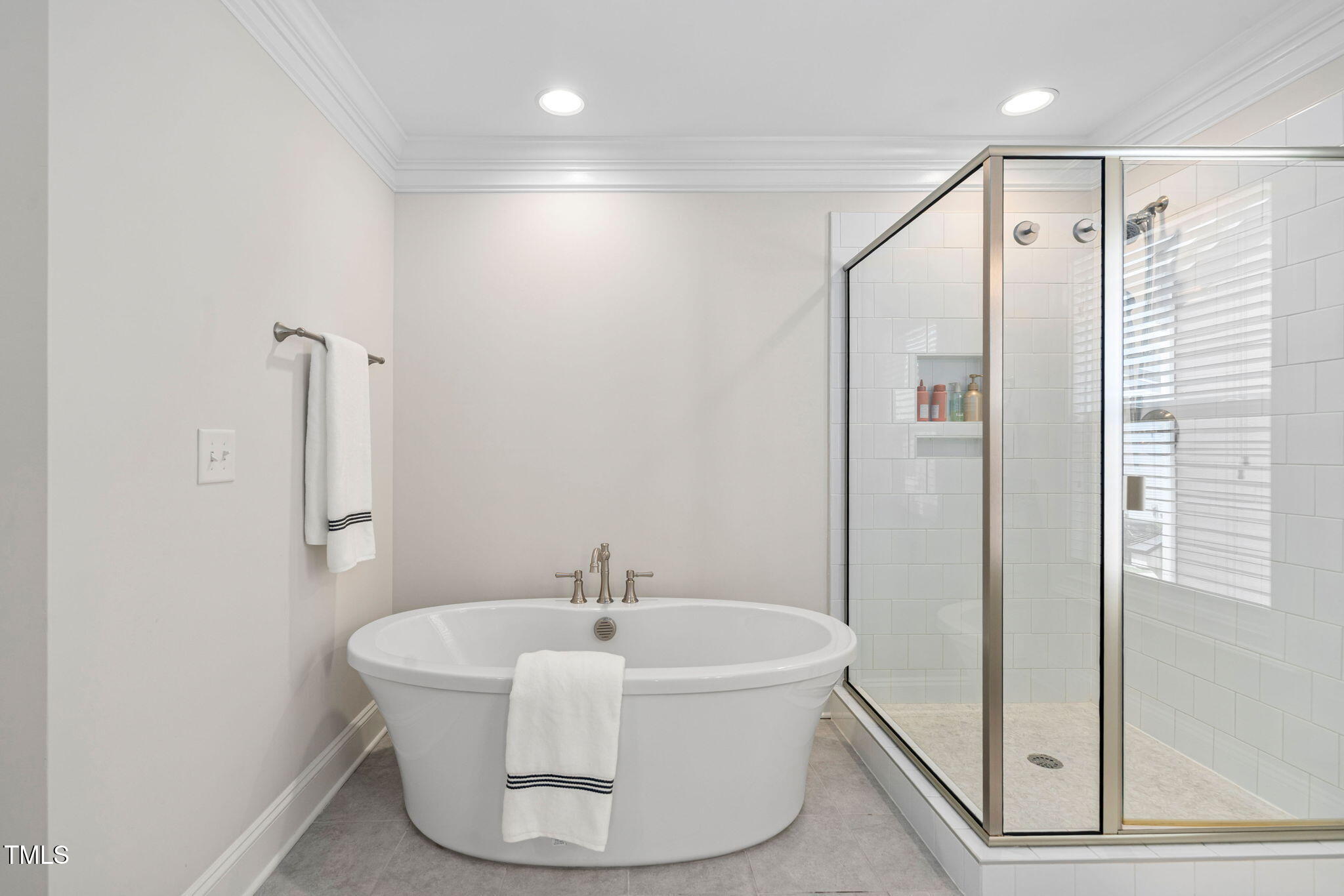 1344 Brown Velvet Lane Apex, NC 27523 - Photo 21 of 63 a white bath tub sitting next to a shower