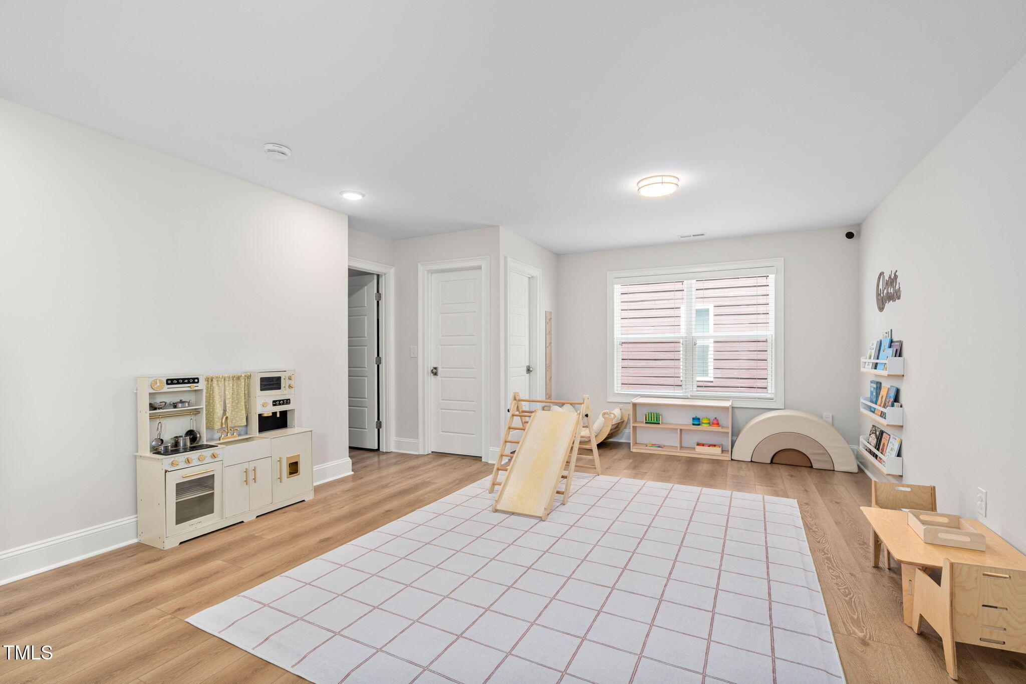 1344 Brown Velvet Lane Apex, NC 27523 - Photo 30 of 63 a spacious bedroom with a bed and a large window