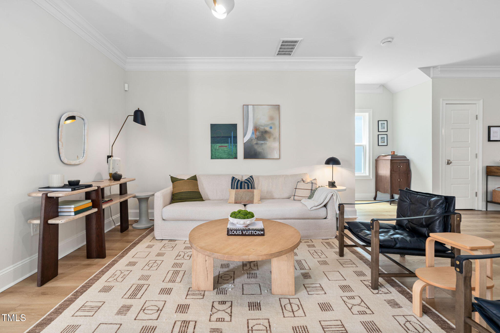 1344 Brown Velvet Lane Apex, NC 27523 - Photo 34 of 63 a living room with furniture a rug and wall painting