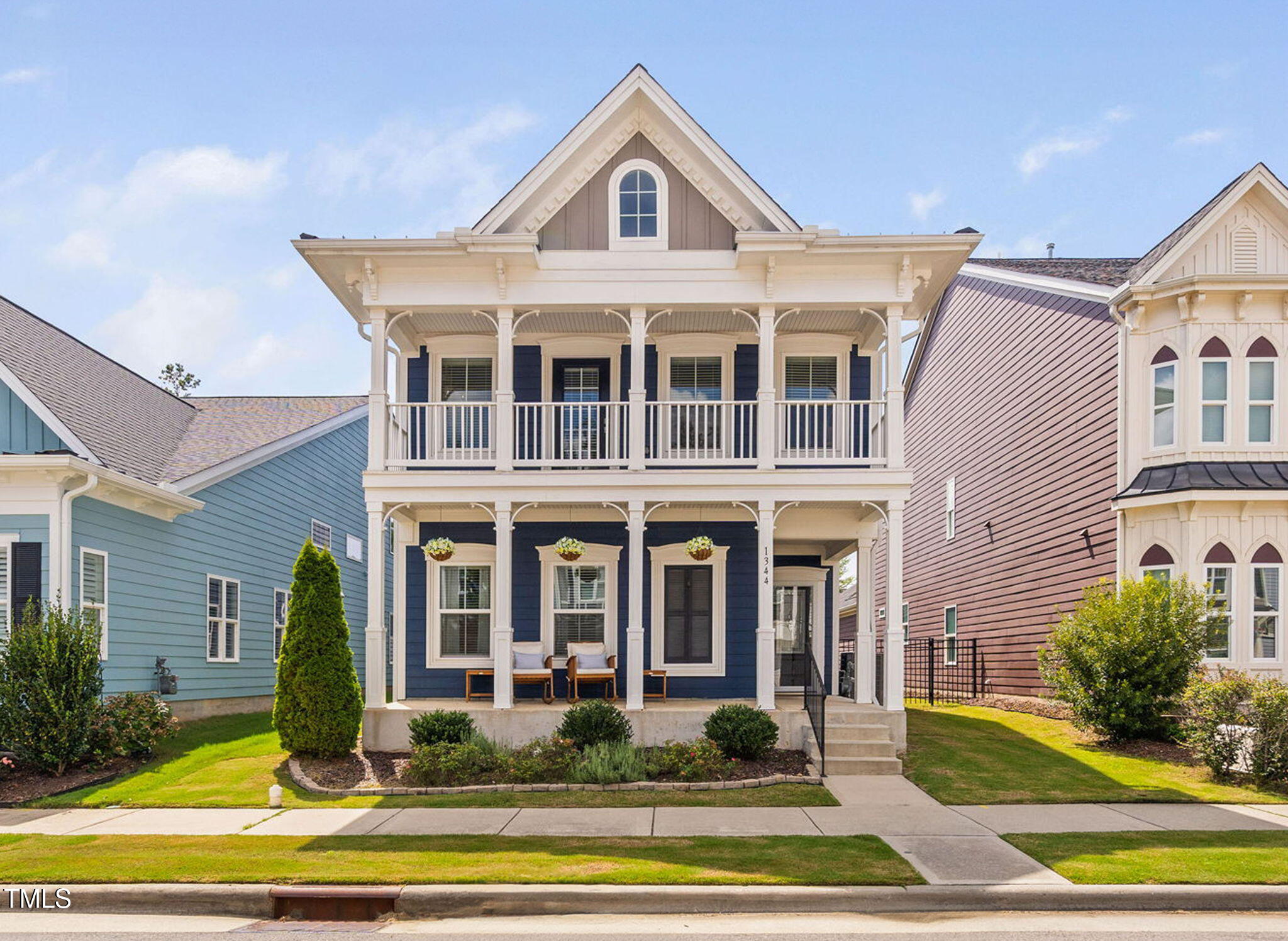 1344 Brown Velvet Lane Apex, NC 27523 - Photo 4 of 63 a view of a big house with wooden fence and large windows