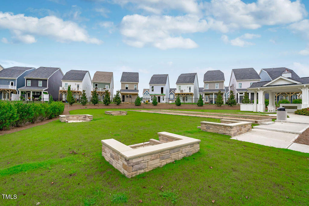 1344 Brown Velvet Lane Apex, NC 27523 - Photo 50 of 63 a front view of a building with garden and trees