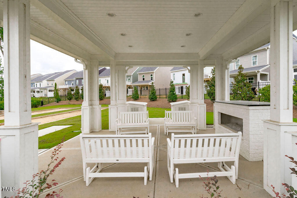 1344 Brown Velvet Lane Apex, NC 27523 - Photo 51 of 63 a view of a chair and tables in the balcony