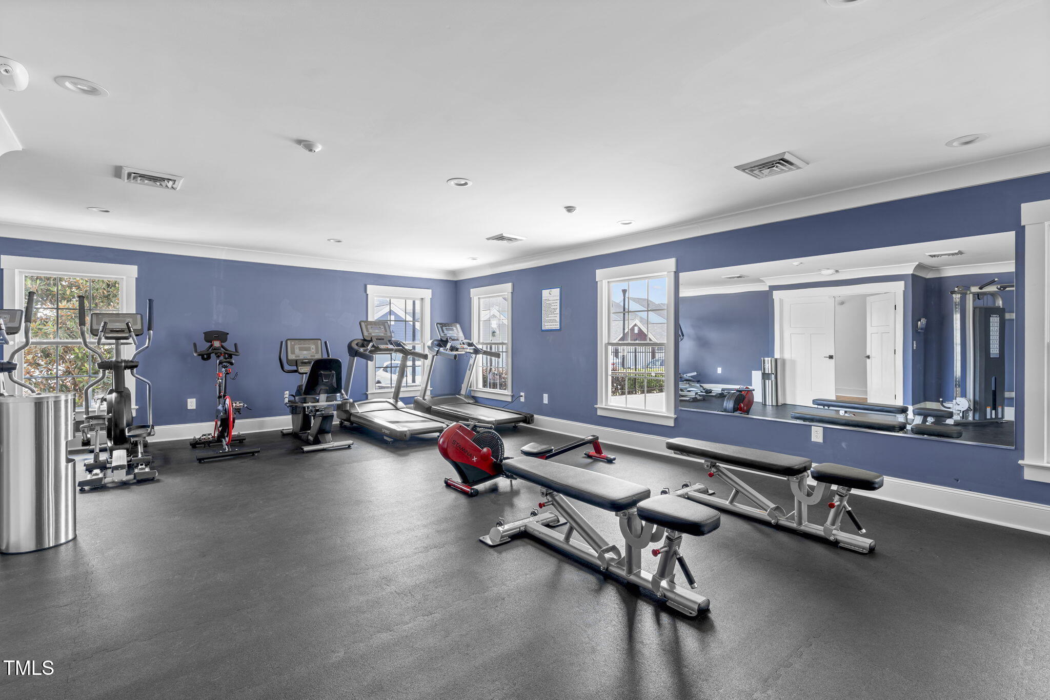 1344 Brown Velvet Lane Apex, NC 27523 - Photo 52 of 63 a room with gym equipment and large window