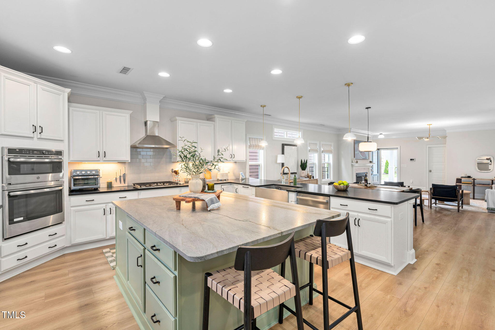 1344 Brown Velvet Lane Apex, NC 27523 - Photo 7 of 63 a kitchen with a stove a sink a counter top space and cabinets