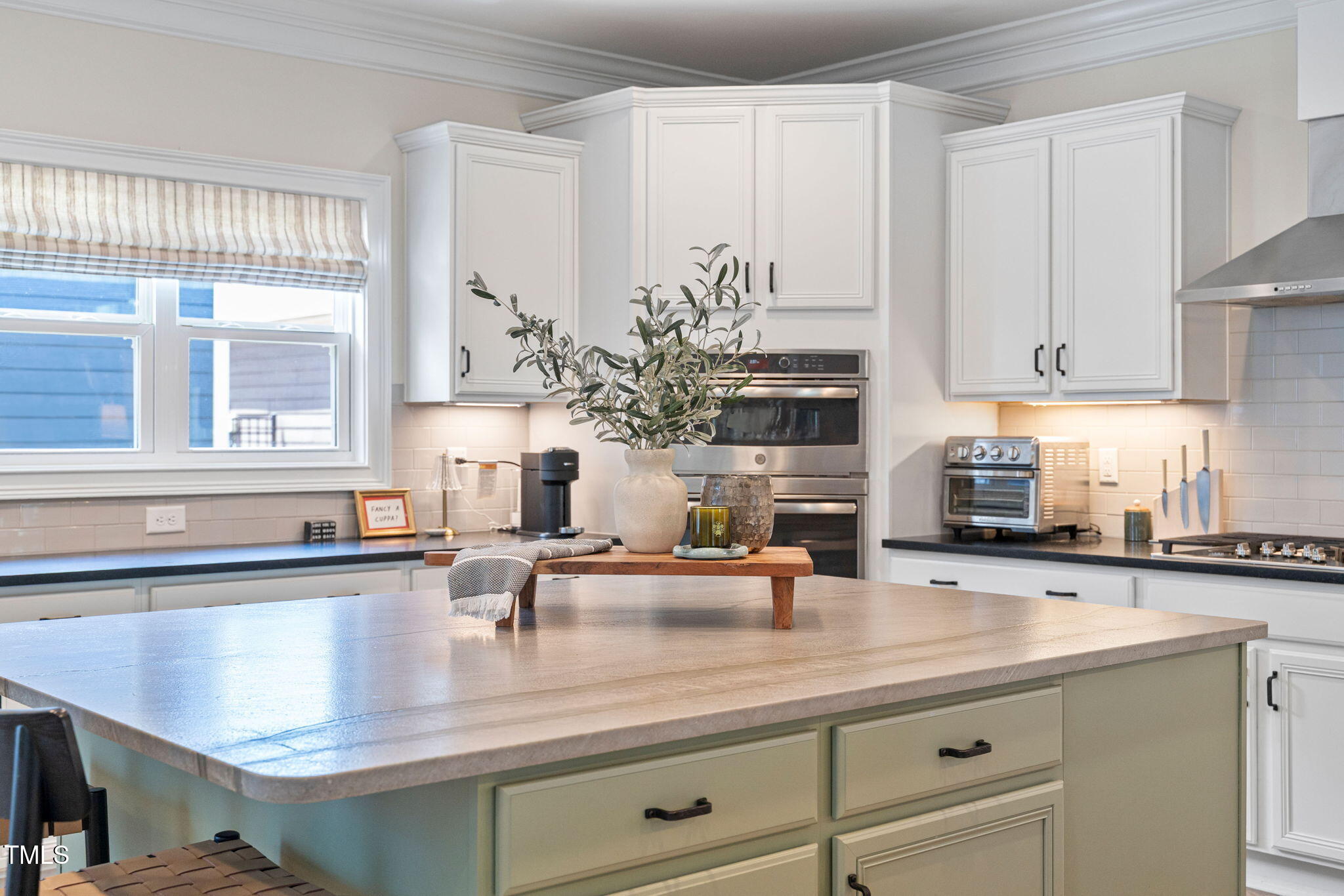 1344 Brown Velvet Lane Apex, NC 27523 - Photo 8 of 63 a kitchen with stainless steel appliances granite countertop a sink a counter space and cabinets
