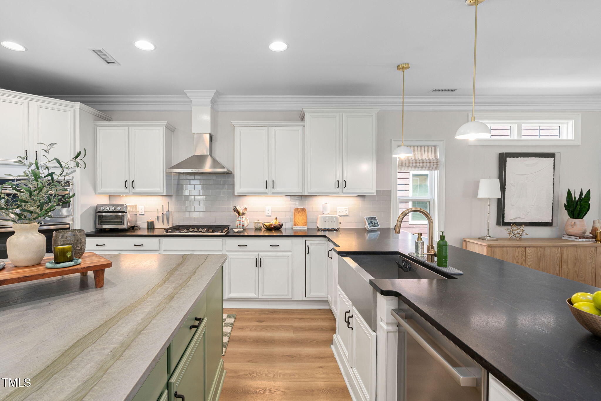 1344 Brown Velvet Lane Apex, NC 27523 - Photo 10 of 63 a kitchen with stainless steel appliances granite countertop a sink stove and cabinets