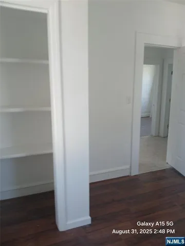 a kitchen with a refrigerator and a stove top oven