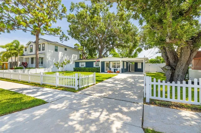 a view of house with a yard