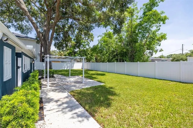 a view of a house with swimming pool and porch with furniture