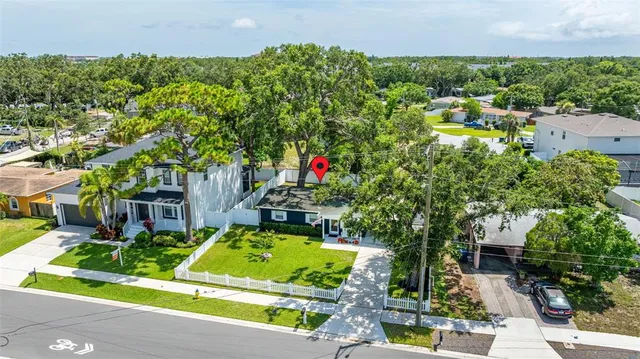 an aerial view of a house with a swimming pool