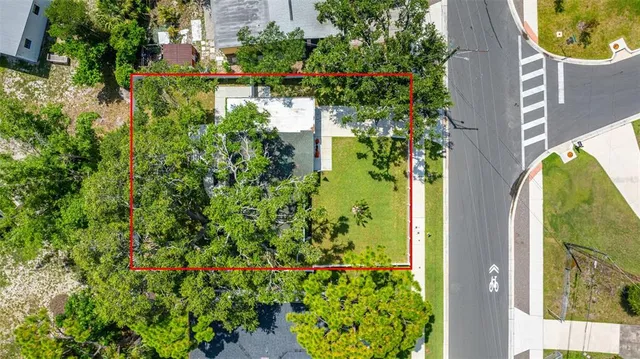 an aerial view of house with yard