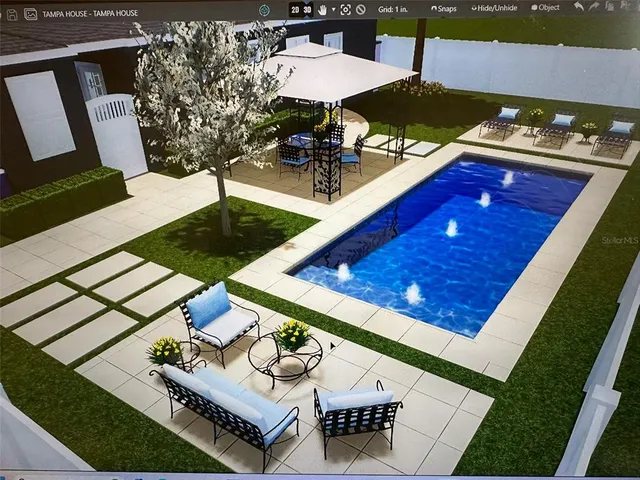 a view of a chairs and table on the grass