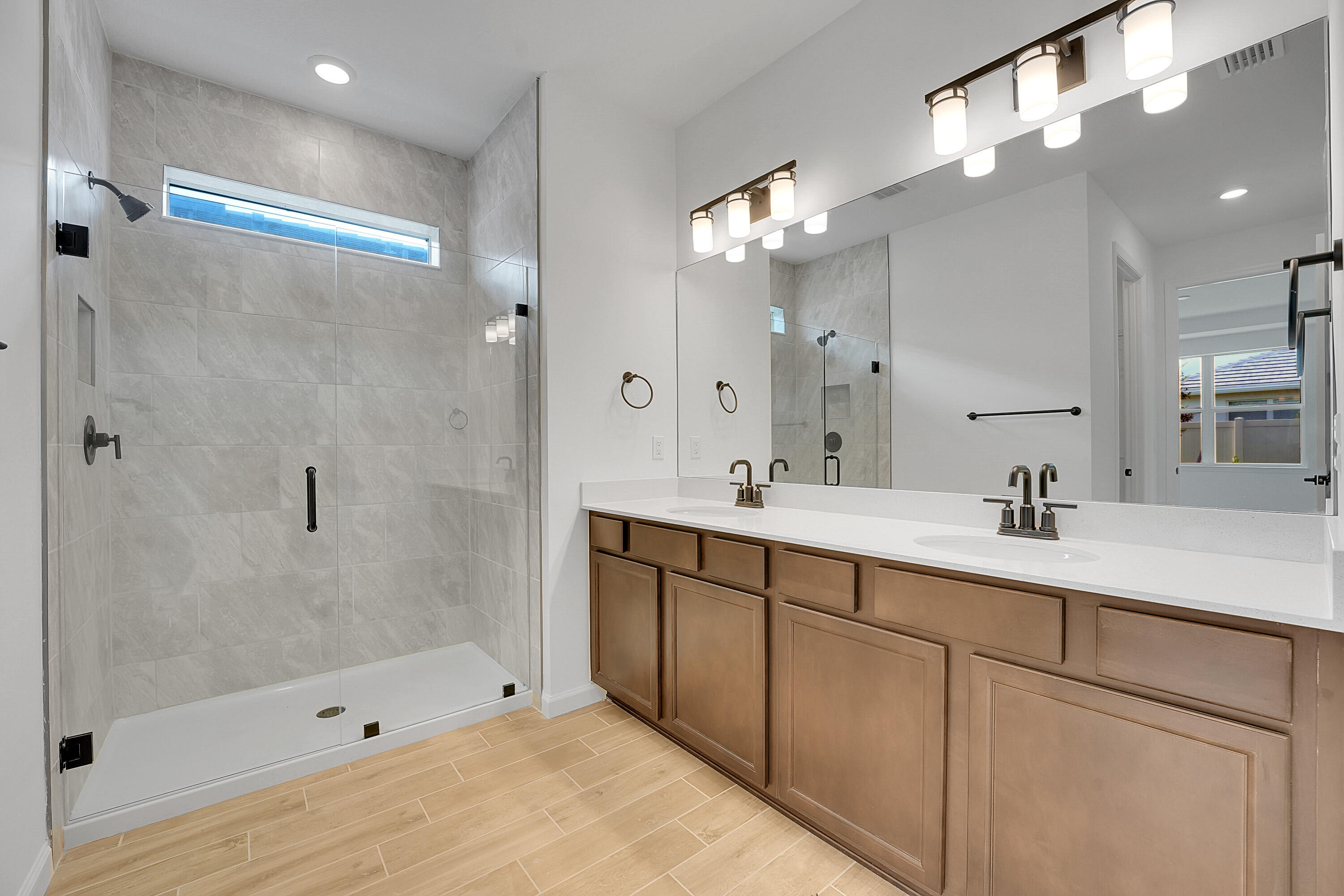 4572 Nautilus Circle Vero Beach, FL 32967 - Photo 12 of 33 a bathroom with a double vanity sink mirror and shower