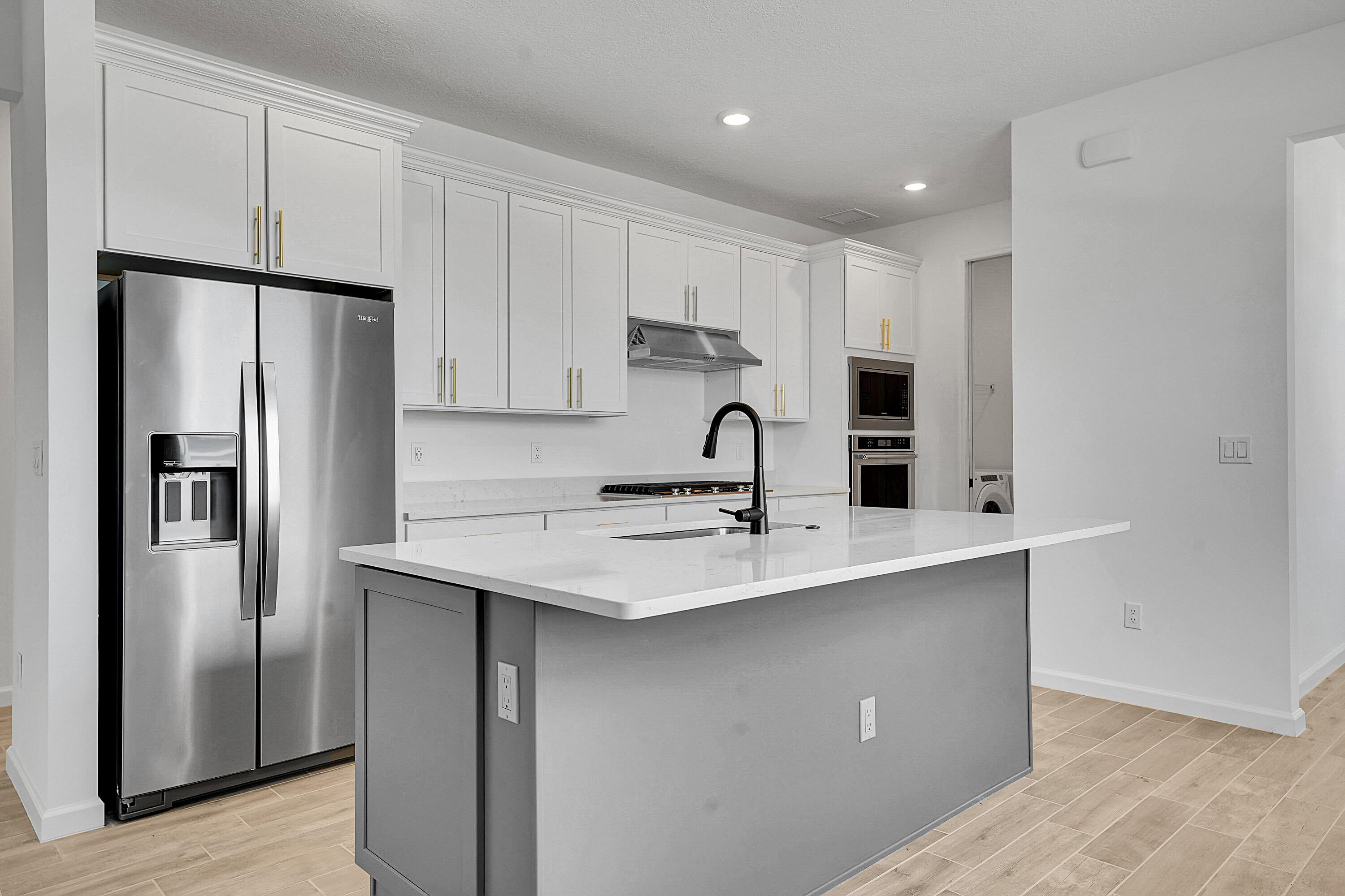 4572 Nautilus Circle Vero Beach, FL 32967 - Photo 4 of 33 a kitchen with stainless steel appliances a sink stove and refrigerator