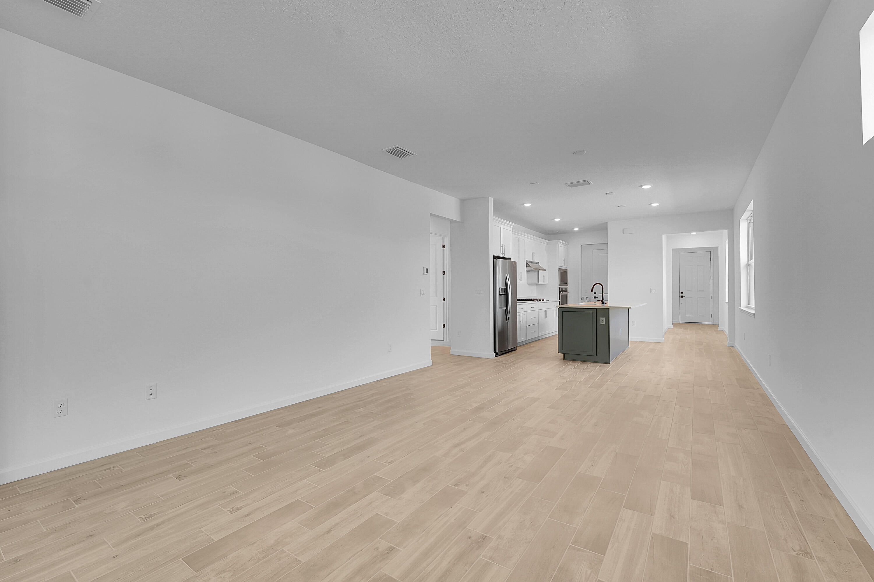 4572 Nautilus Circle Vero Beach, FL 32967 - Photo 9 of 33 a view of empty room with a kitchen