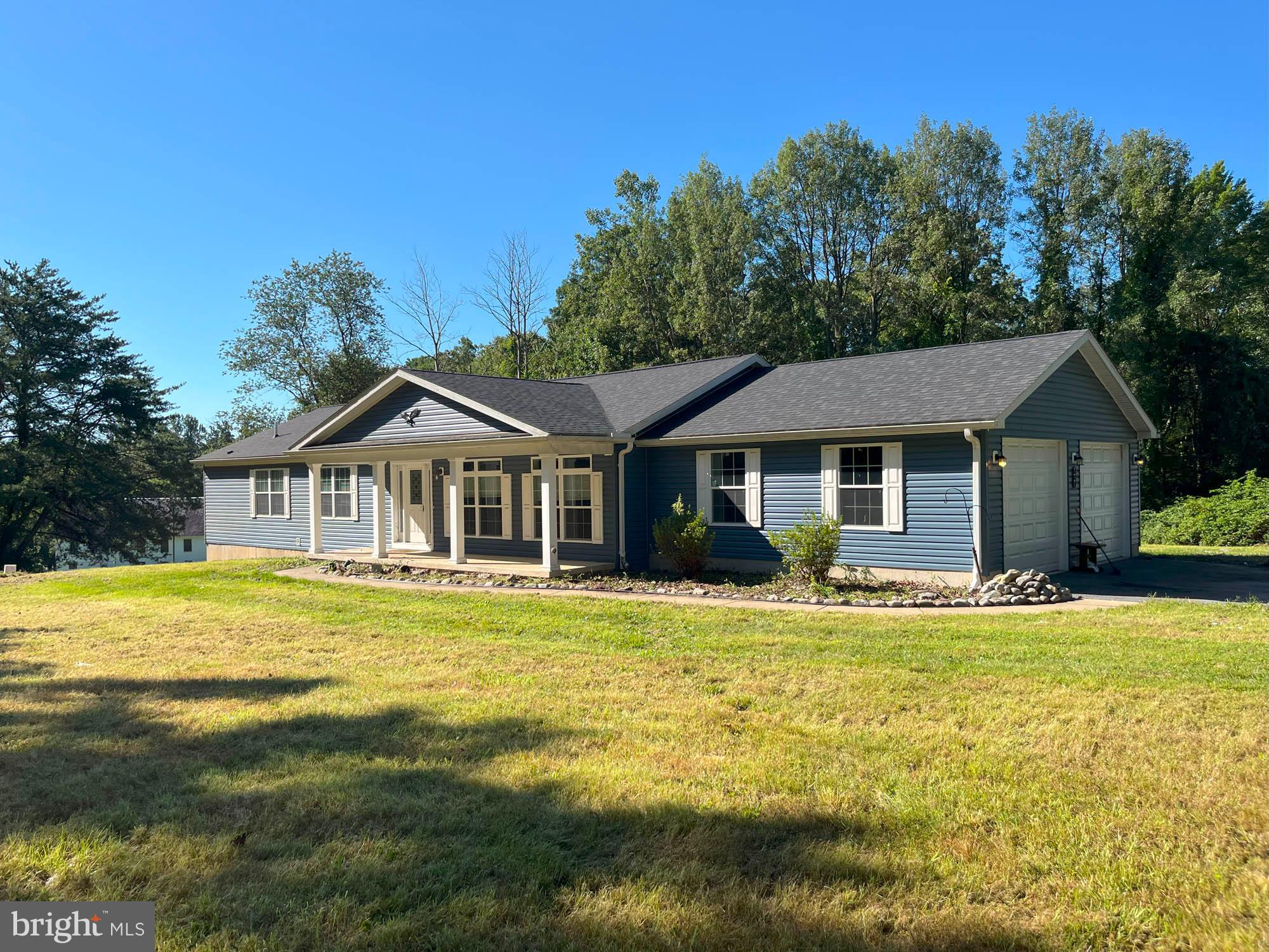 801 Lagrange Road Street, MD 21154 - Photo 1 of 33 a front view of a house with swimming pool having outdoor seating