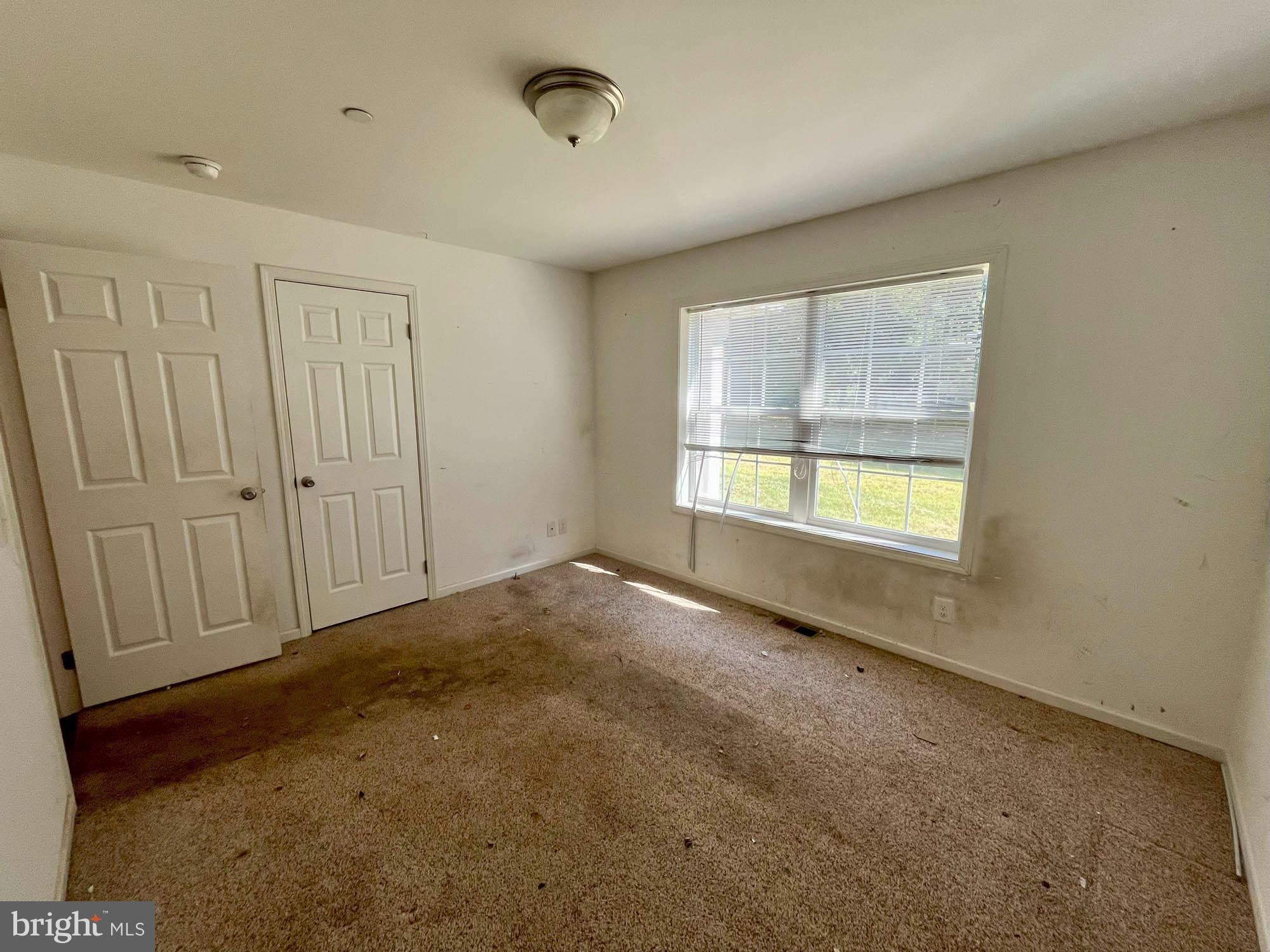 801 Lagrange Road Street, MD 21154 - Photo 13 of 33 a view of an empty room with a window
