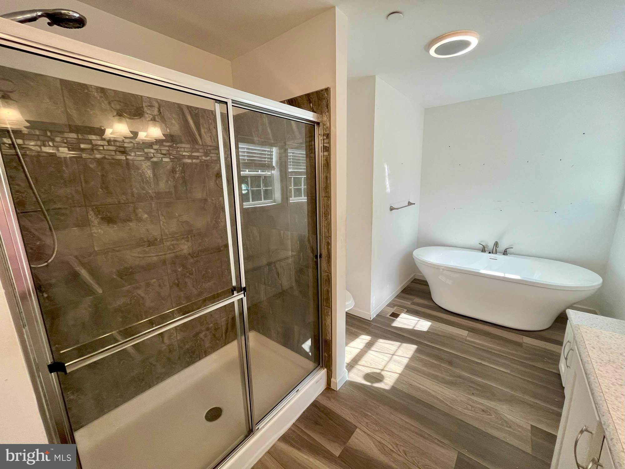 801 Lagrange Road Street, MD 21154 - Photo 17 of 33 a bathroom with a shower and mirror