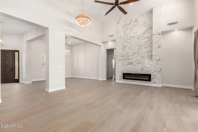 an empty room with closet and mirror