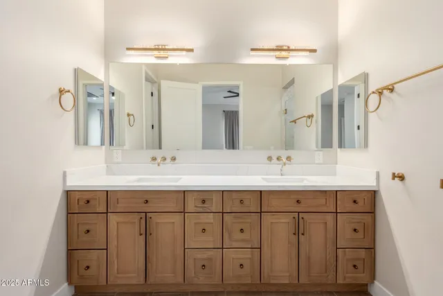 a kitchen with a sink cabinets and stainless steel appliances