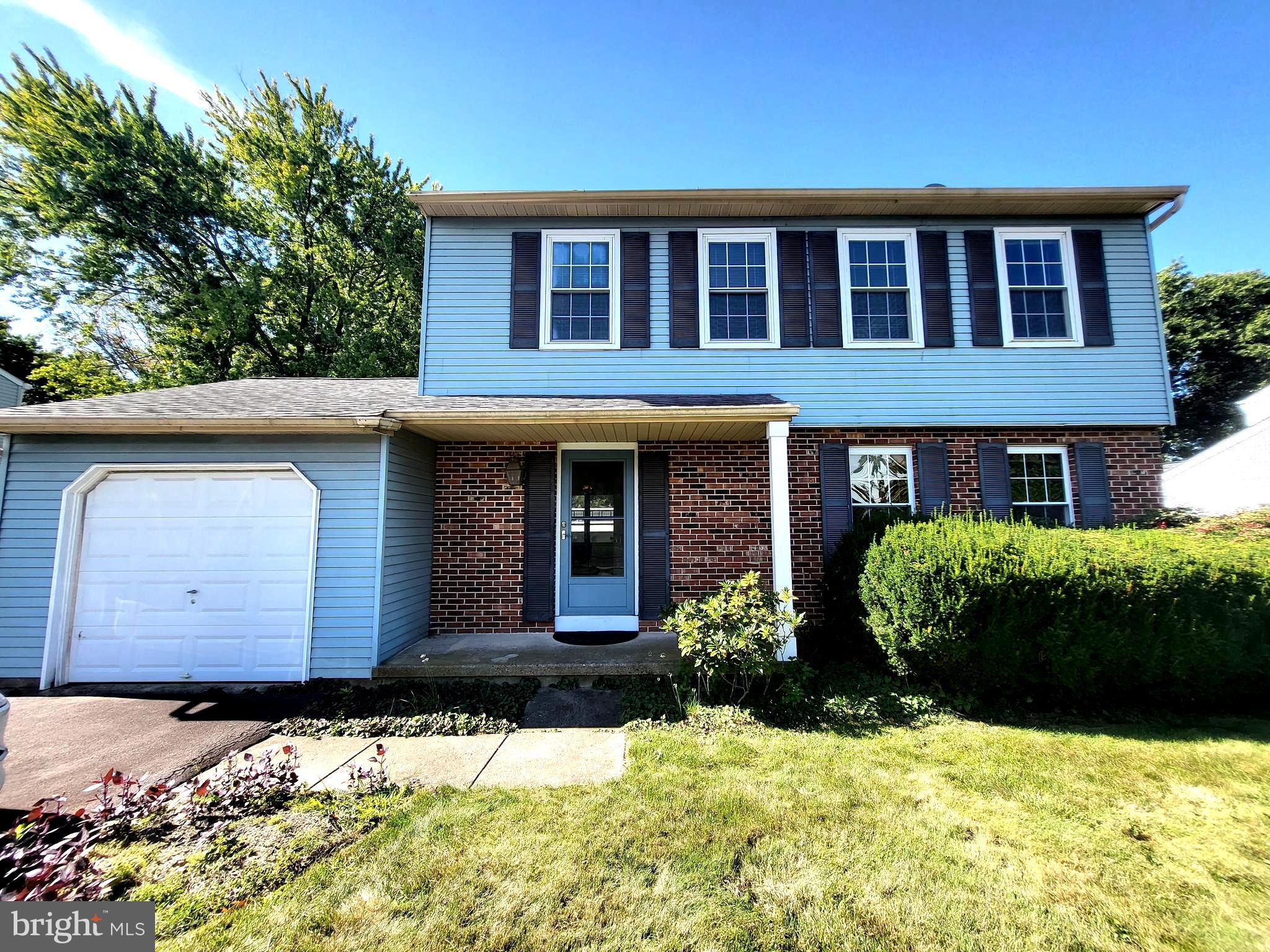 110 Station Drive North Wales, PA 19454 - Photo 1 of 15 a front view of a house with a yard