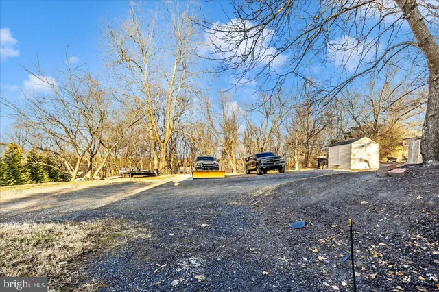 a view of a swimming pool with a house in the background