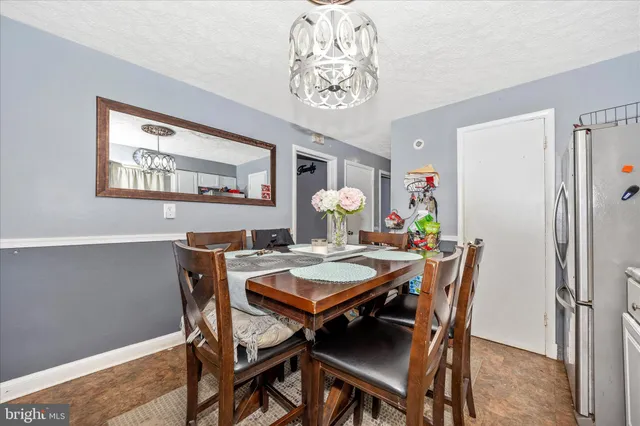 a kitchen with granite countertop a stove and a wooden cabinets