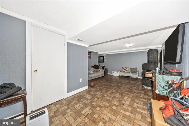 a bedroom with a bed and a desk