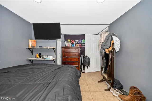 a view of walk in closet with clothes