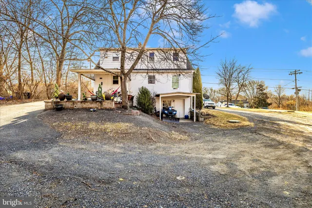 a view of a town with snow on the road